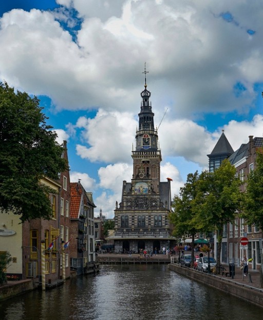 The De Waag weighing house tower rising above a canal in central Alkmaar, Netherlands