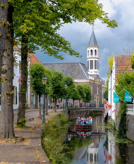 Traditional Dutch canal houses under blue sky - the Netherlands is one of the best places to retire in Europe