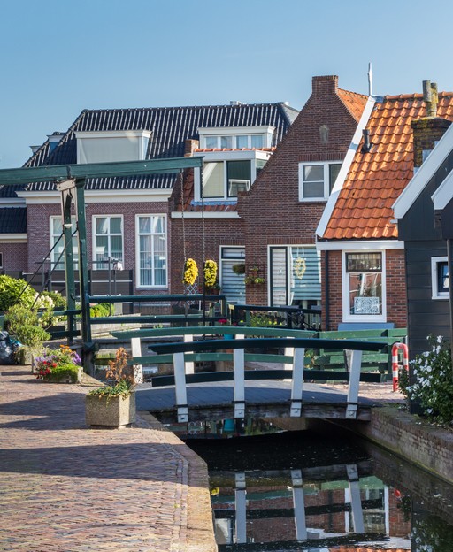 Canal and traditional wooden houses in Volendam, Netherlands